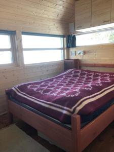 En eller flere senge i et værelse på Skarehaug - koselig hytte med 3 soverom