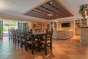 a dining room with a table and chairs at VILLA TERRABIANCA - Premium Villas in Tortoreto Lido