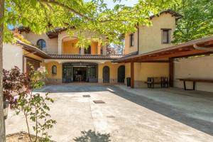 an exterior view of a house with a courtyard at VILLA TERRABIANCA - Premium Villas in Tortoreto Lido