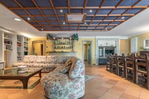 a living room with a couch and a table at VILLA TERRABIANCA - Premium Villas in Tortoreto Lido