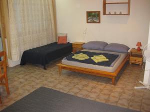 Posteľ alebo postele v izbe v ubytovaní Parti Apartman
