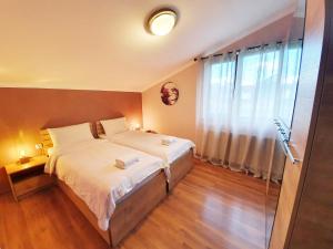 Кровать или кровати в номере ---Allegria House---