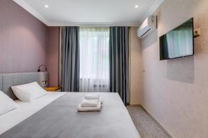 Ένα ή περισσότερα κρεβάτια σε δωμάτιο στο Отель "Monami"