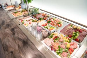 a buffet line with many different types of food at LIHO - einfach Lübeck in Lübeck