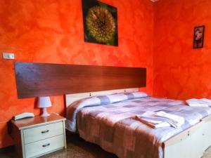 Postel nebo postele na pokoji v ubytování Hotel Violetta