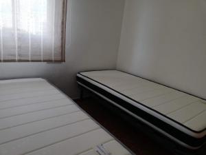 Een bed of bedden in een kamer bij Cancun VII Solo Familias Serviplaya