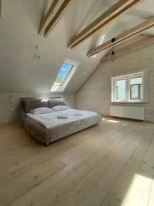 Postel nebo postele na pokoji v ubytování Domki&Apartamenty Koszarka