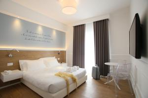 Posteľ alebo postele v izbe v ubytovaní Hotel Le Ginestre Family & Wellness