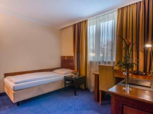 Postel nebo postele na pokoji v ubytování Hotel Glöcklhofer