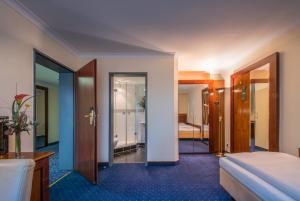 Postel nebo postele na pokoji v ubytování Hotel Glöcklhofer