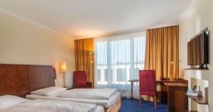 Postel nebo postele na pokoji v ubytování Hotel Glöcklhofer