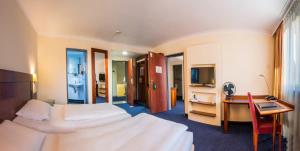 Postel nebo postele na pokoji v ubytování Hotel Glöcklhofer