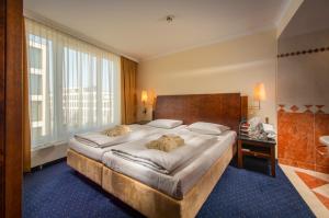 Postel nebo postele na pokoji v ubytování Hotel Glöcklhofer