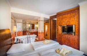 Postel nebo postele na pokoji v ubytování Hotel Glöcklhofer + 37 fotografií