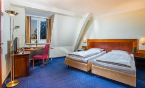 Postel nebo postele na pokoji v ubytování Hotel Glöcklhofer