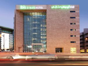 a building with a car in front of it at Ibis Styles Dubai Jumeira in Dubai