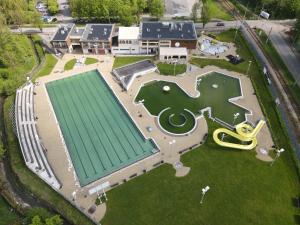 an aerial view of a building with a golf course at Noclegi PAŃSKA Góra in Andrychów