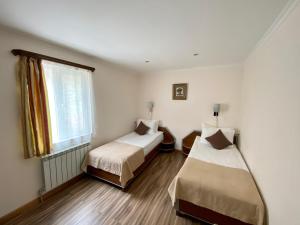 A bed or beds in a room at Alva Hotel & Spa