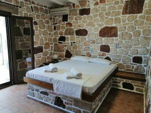 Postel nebo postele na pokoji v ubytování Athina EcoFarm