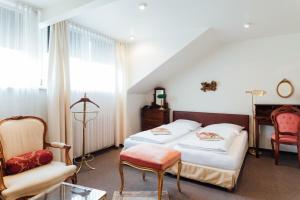 Postel nebo postele na pokoji v ubytování Das Kleine Hotel in ruhiger Stadtlage
