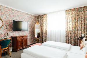Postel nebo postele na pokoji v ubytování Das Kleine Hotel in ruhiger Stadtlage