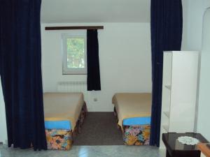 A bed or beds in a room at Apartment in Medulin with loggia, air conditioning, WiFi (3549-5)
