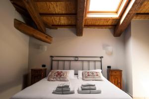 A bed or beds in a room at Eremo della Gasprina