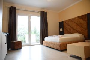 Voodi või voodid majutusasutuse Monte Mare Hotel toas