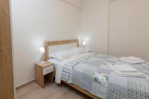 Postel nebo postele na pokoji v ubytování (Apt.1) Lofos Apartments in Vergia Halkidiki