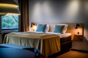 Voodi või voodid majutusasutuse Fjordgaarden - Spa - Hotel - Konference toas
