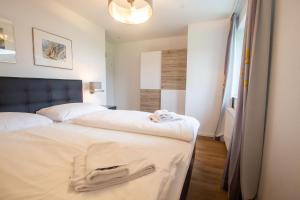 Łóżko lub łóżka w pokoju w obiekcie Panorama Apartments - Steinbock Lodges