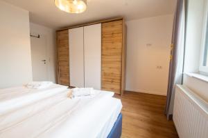 Łóżko lub łóżka w pokoju w obiekcie Panorama Apartments - Steinbock Lodges