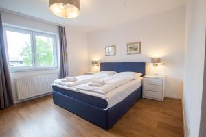 Łóżko lub łóżka w pokoju w obiekcie Panorama Apartments - Steinbock Lodges