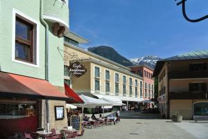 a street in a town with tables and chairs at Ferienwohnung BGD in Berchtesgaden