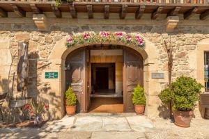 a building with an arch with flowers on it at La Casona de Hermosa in Hermosa