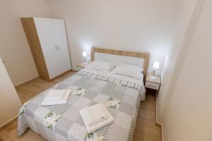 Postel nebo postele na pokoji v ubytování (Apt.1) Lofos Apartments in Vergia Halkidiki