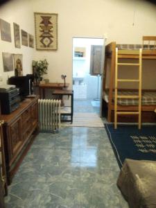 a living room with a bunk bed and a desk at Apartamento Sol y Vida Tabernas in Tabernas