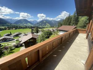 a balcony with a view of the mountains at Apartment Sonnige Matte by Interhome in Gstaad