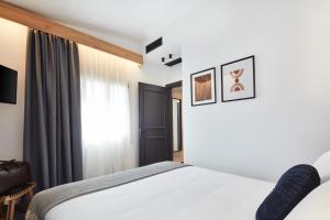 A bed or beds in a room at Λιθεία-Lithia