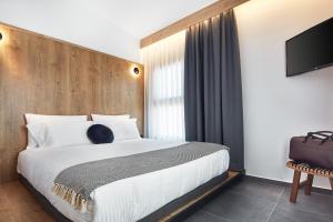 A bed or beds in a room at Λιθεία-Lithia
