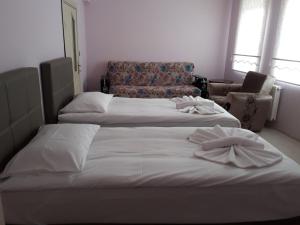 Postel nebo postele na pokoji v ubytování Dirilis Banarya Apart hotel