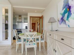 a kitchen and dining room with a table and chairs at Apartment Le Roc by Interhome in Cannes