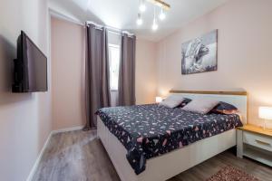 Postel nebo postele na pokoji v ubytování Apartment Glory