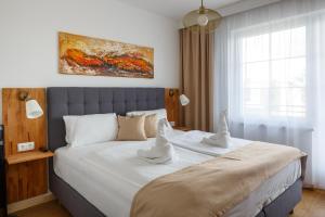 Posteľ alebo postele v izbe v ubytovaní Pension Laubenhof