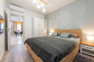 Postel nebo postele na pokoji v ubytování Apartment Glory