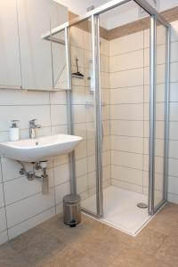 a bathroom with a sink and a shower at Gästehaus Schütz in Spitz