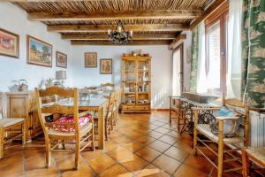 a dining room with a table and chairs at 6 bedrooms villa with private pool furnished terrace and wifi at Puebla de Don Rodrigo in Puebla de Don Rodrigo