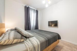 Postel nebo postele na pokoji v ubytování Apartment Glory