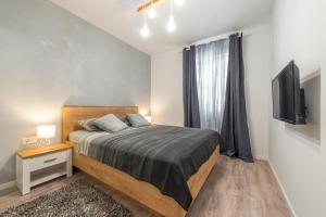 Postel nebo postele na pokoji v ubytování Apartment Glory