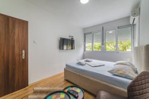 A bed or beds in a room at Top-Top